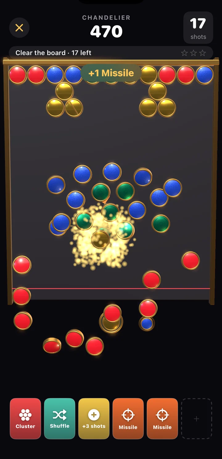 A capsule bursting open in gold sparks as discs tumble off the board